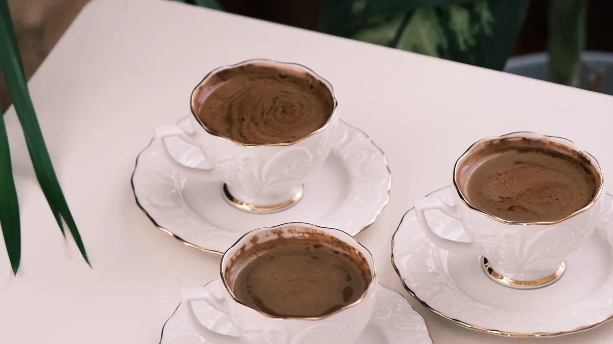 Three cups arranged together, representing you, the platform and the referring site in the GoHighLevel affiliate program