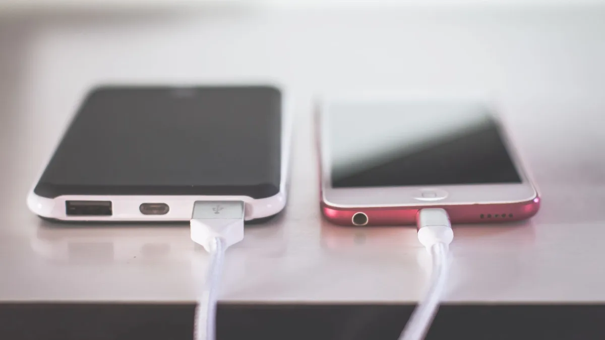 Two connected smartphones side by side, representing texting registration alongside phone number porting