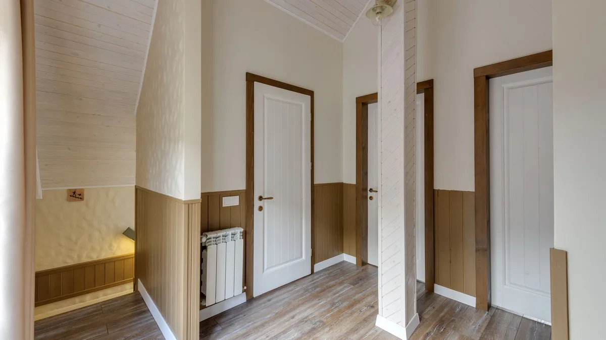 A bright hallway with three doors, representing the choices before a sub-account transfer