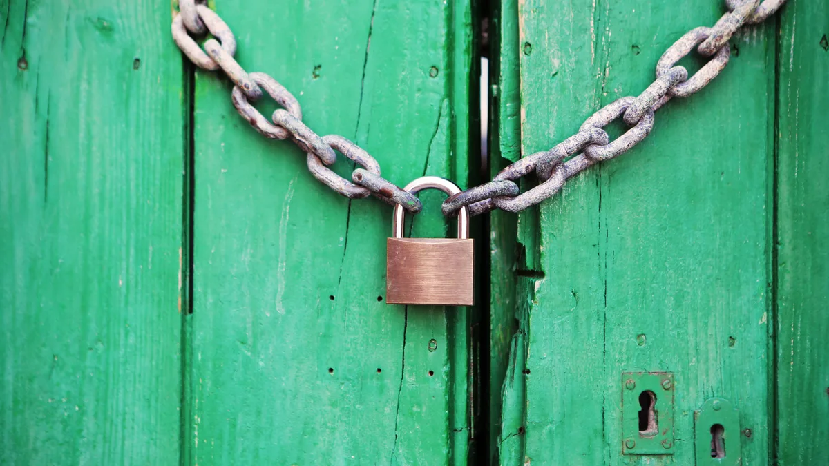 A padlocked door, representing a white label CRM account you cannot move without the right permissions