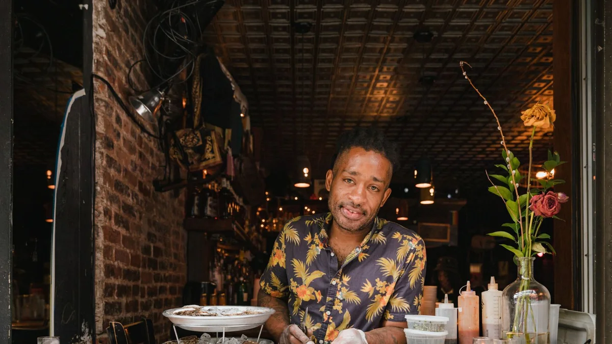 A restaurant owner works behind his counter, from our GHL contact first name guide